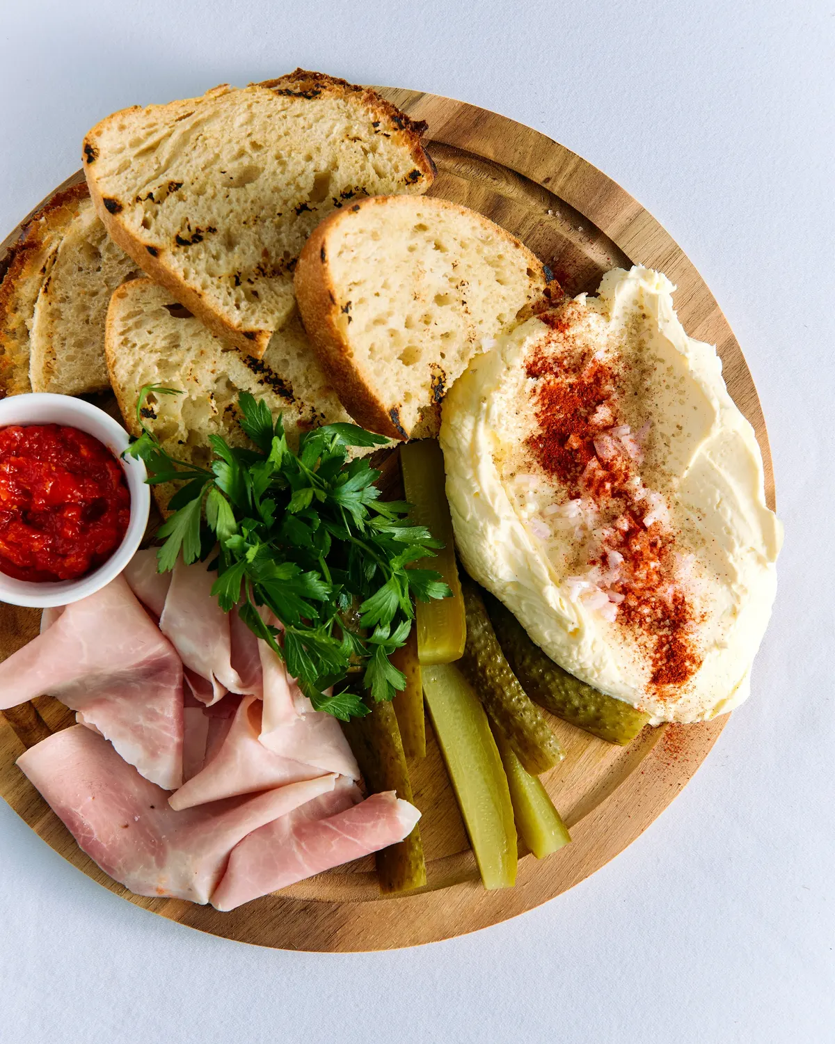 Antipasti board with bread and ham