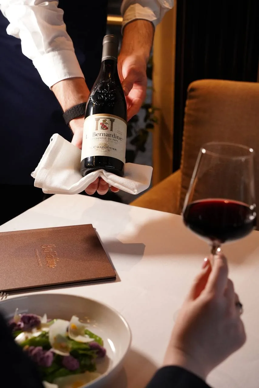 Red wine poured at the table