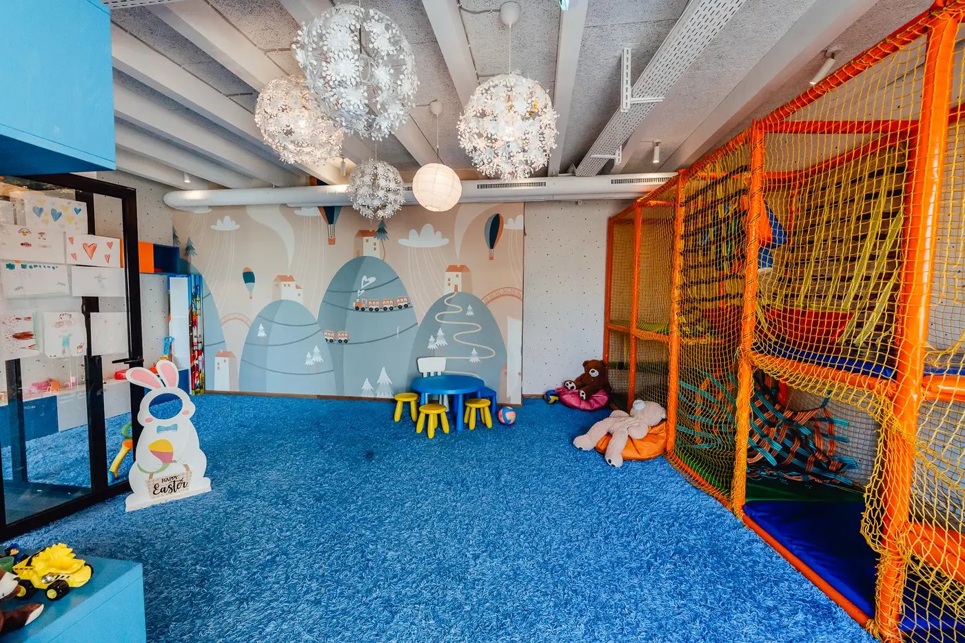 Playroom with drawing table and toys