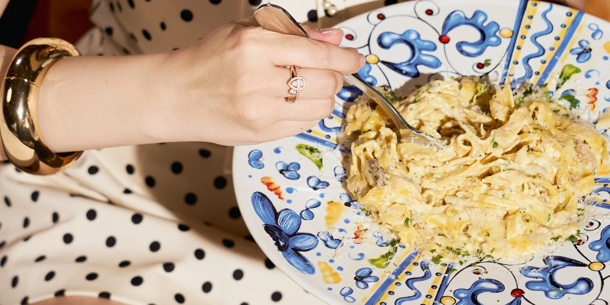 Guest with a plate of pasta at Buffalino